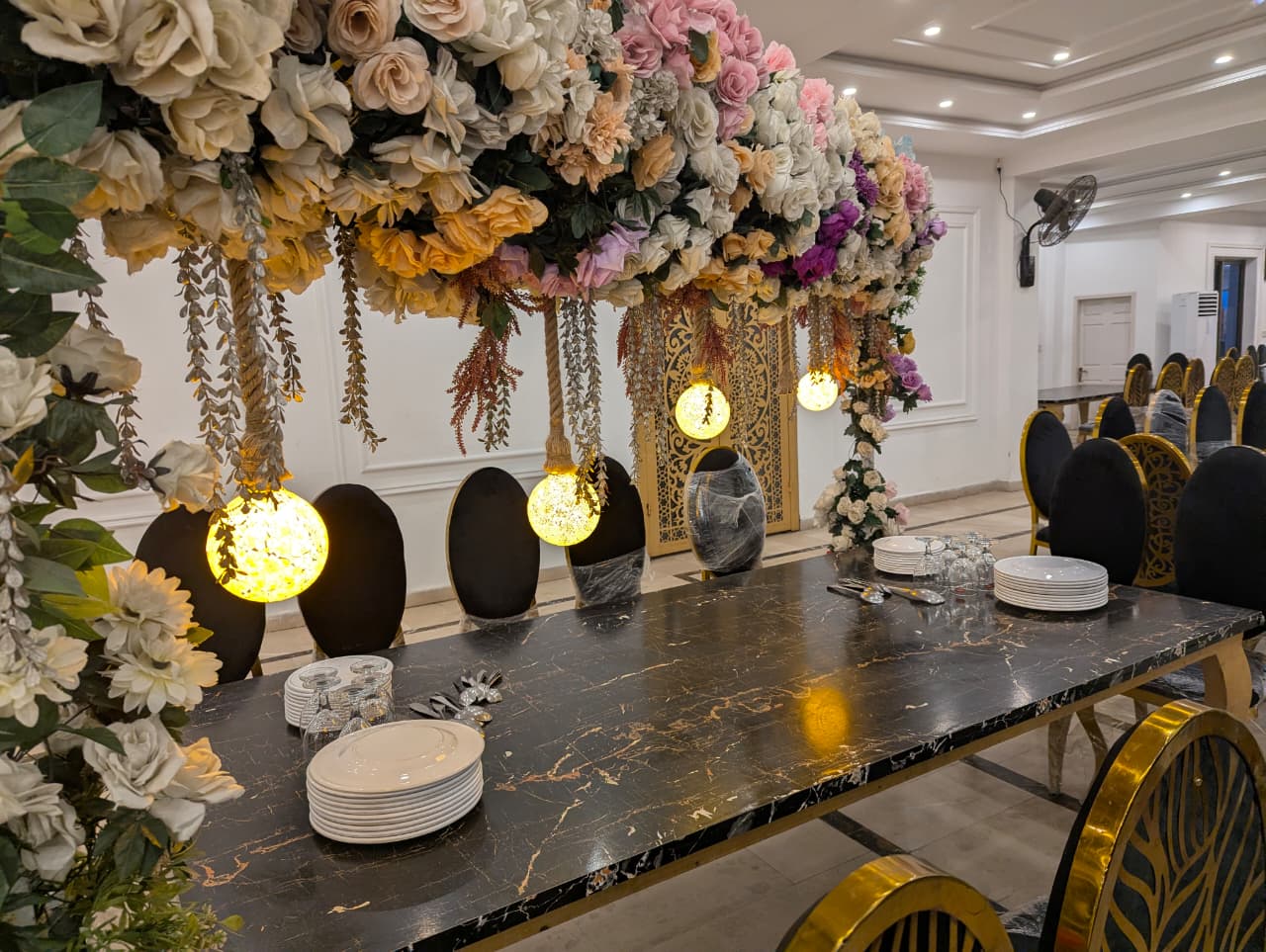 Dining table under floral canopy